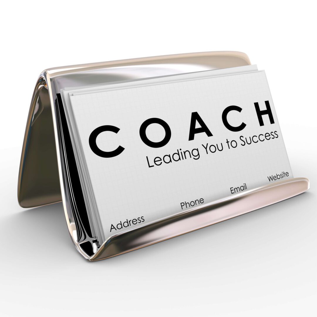 A business card holder with the word coach on it.